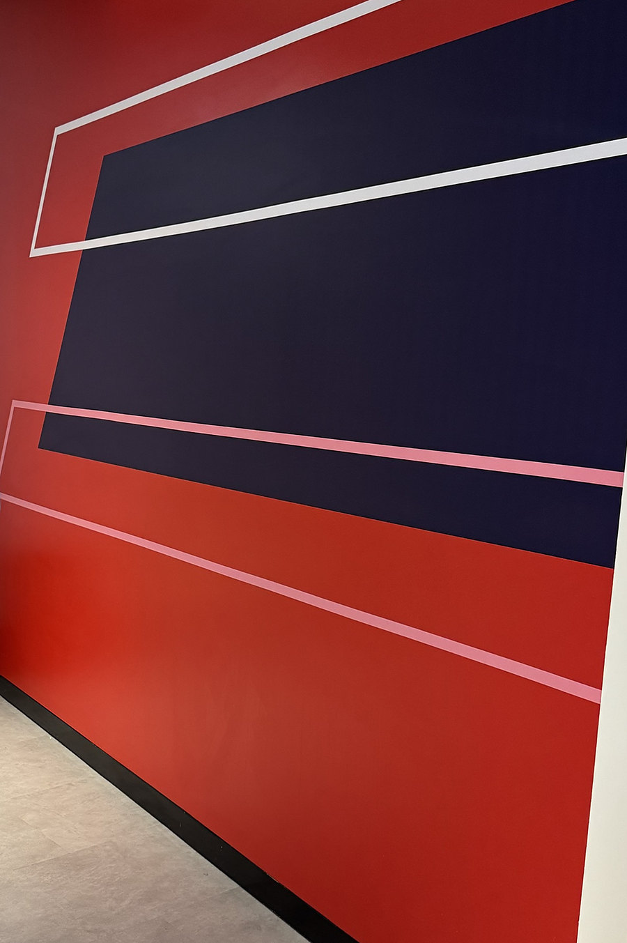 Red and navy geometric feature wall