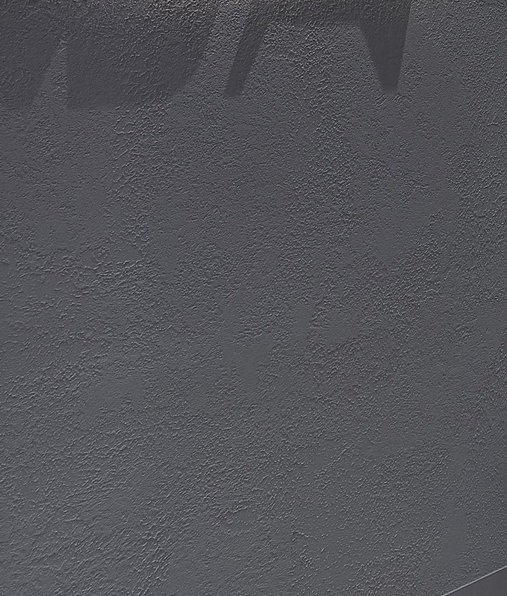 Grey textured render on a retail shopfront